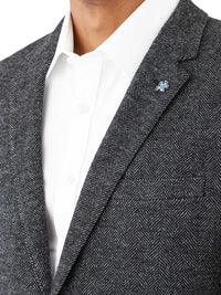 Indulge in luxury with the Uberstone Zeller Sports jacket. Made from a wool blend, this jacket boasts a skinny fit, natural shoulder, and notch lapel for a sophisticated look. The textured herringbone design in charcoal is perfect for winter and pairs well with black chinos or trousers. Elevate your style with this exclusive piece. Limited Edition (If your size is not available, call us to check suppliers warehouse, we will get back to you ASAP)